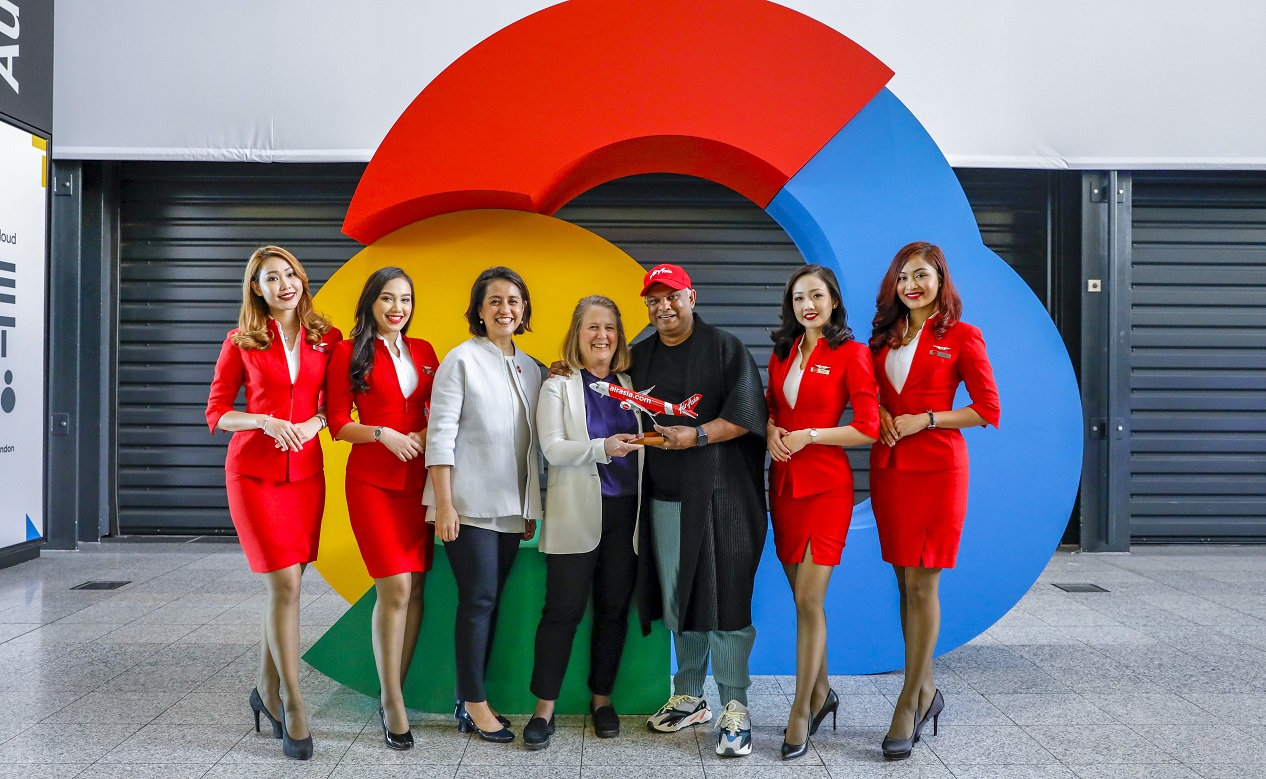 Google Cloud CEO Diane Green (centre), AirAsia Group CEO Tony Fernandes and AirAsia Deputy Group CEO (Digital, Transformation and Corporate Services) Aireen Omar flanked by AirAsia cabin crew at Google Cloud NEXT '18 in London