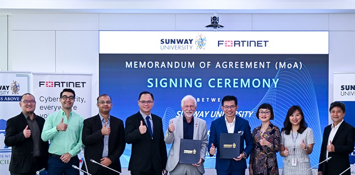 Professor Sibrandes Poppema (5th from left), President, Sunway University with Dickson Woo (4th from right), Country Manager, Fortinet Malaysia at the signing with colleagues from Sunway Uni and Fortinet.