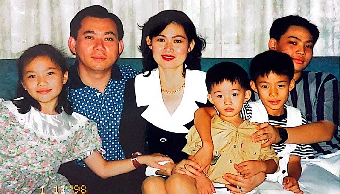 Joshua Ong (right) with his parents and siblings when he was 12.