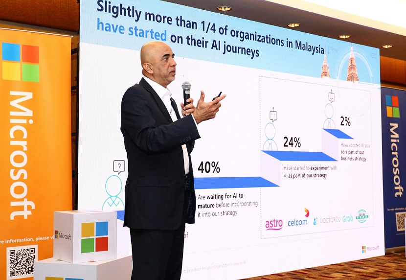 More investment, less talk needed to drive AI adoption: Microsoft