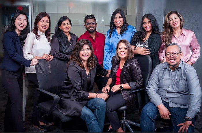 Manminder Kaur (seated, left) and Puspavathy Ramaloo (seated, centre), co-founders of publCT.io with their team.