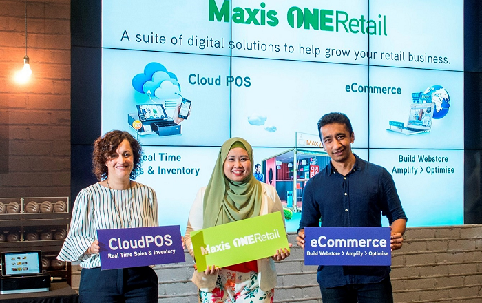 Maxis Enterprise executives promoting one of its retail offerings.