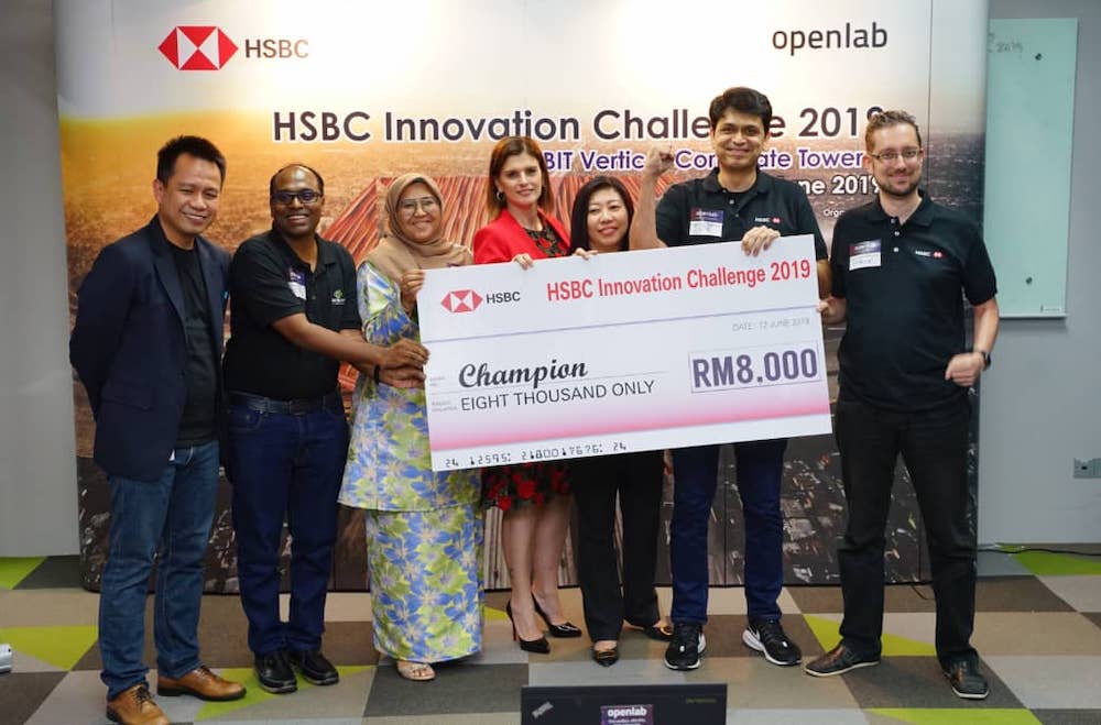 MDEC Growth Ecosystem Development VP Norhizam Abdul Kadir (first left); HSBC Malaysia Retail Banking and Wealth Management country head Tara Latini (fourth left); and MDEC COO Ng Wan Peng (fifth left) with members of the winning team RICHA